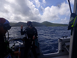 National Coral Reef Monitoring Program (NCRMP) divers, Lexie Sturm and Joseph Contillo, get ready for a dive in St. John, USVI, 2023. NCRMP divers survey the fish and benthic communities of our nation's coral reef ecosystems. Credit: Nicole Rotelle/National Park Service